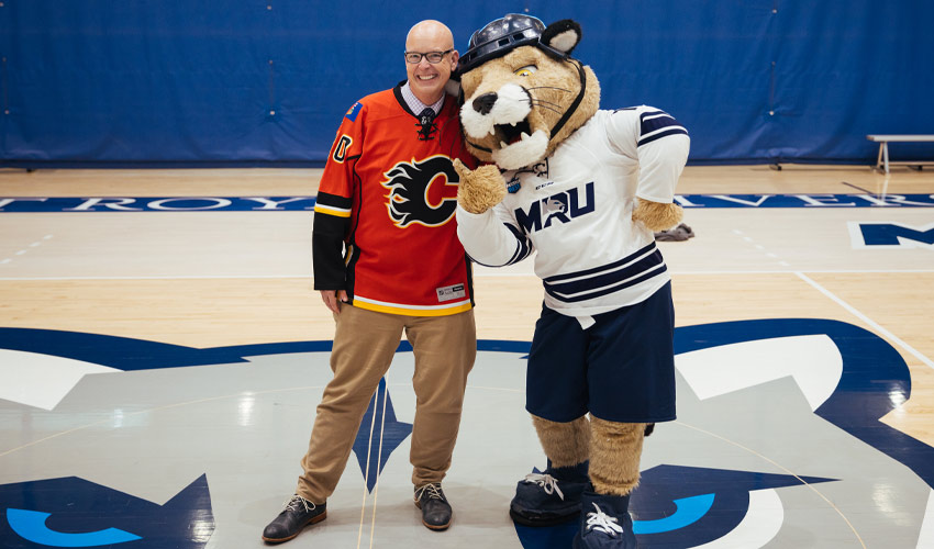 MRU President and Vice-Chancellor Tim Rahilly, PhD and Calvin the Cougar.