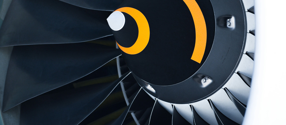 A detailed view of a jet engine, showcasing its intricate components and powerful design.