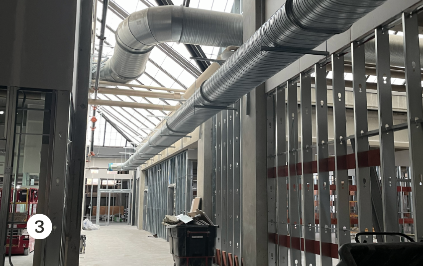 the existing glass panel ceiling has been incorporated into the design.