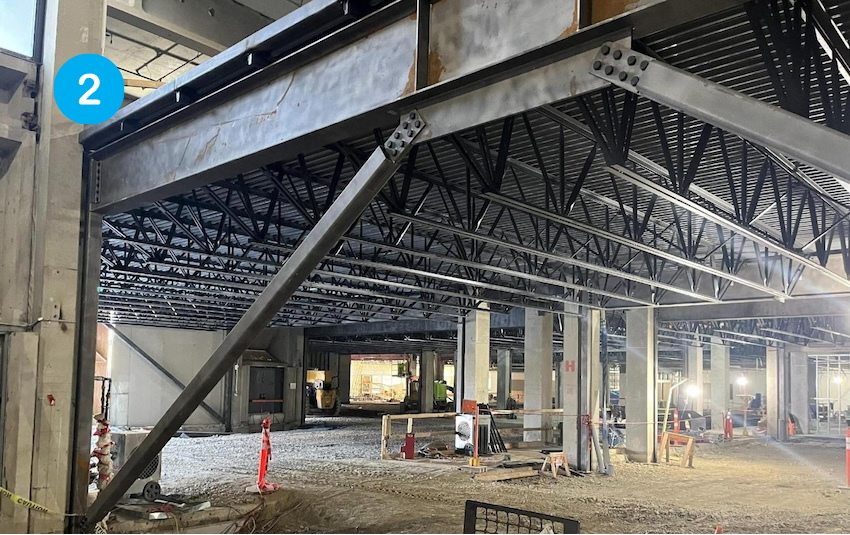 Steel decking is laid overtop of the structural steel beams for the new classroom floors.