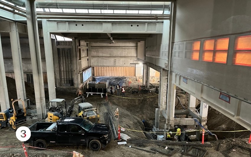 Photo 3 is a view down into a large open area inside G-wing. 