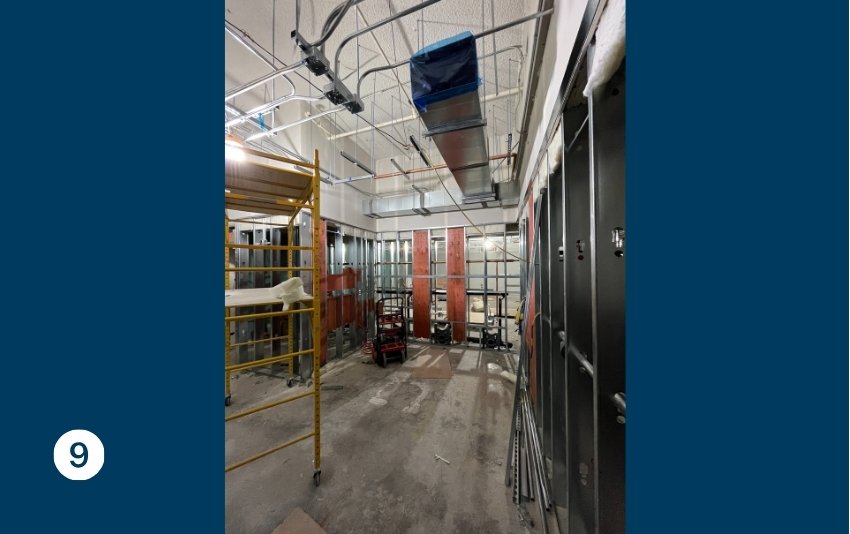 Photo 9 shows framing on the walls and work on a drop ceiling.