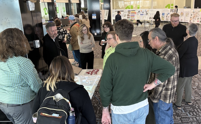 Participants review and discuss the draft LRDP concepts shown on the 3D model.