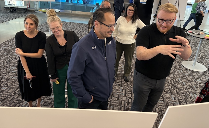 Tori McMillan, director of the Iniskim Centre, centre, discusses the draft LRDP with Stantec’s Kevin Mullin, principal architect, who is supporting Mount Royal’s LRDP process.