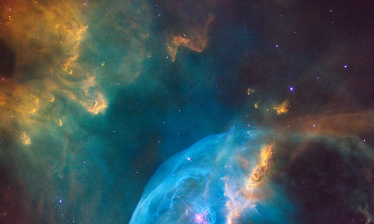 Colourful image of a galaxy or nebula in space.