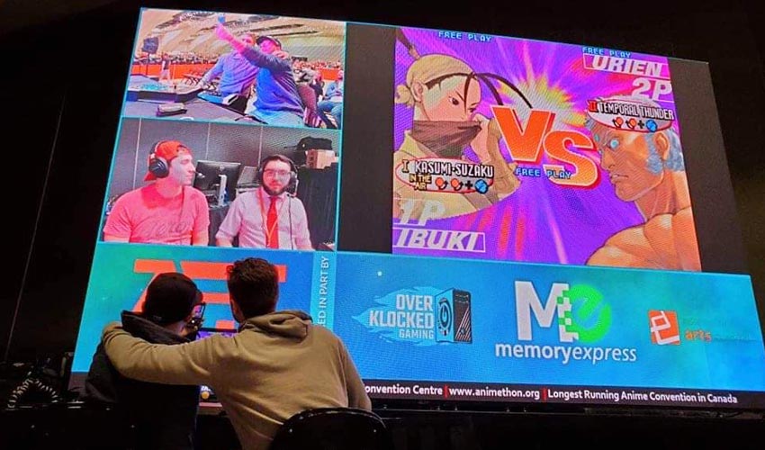 Photo of 2 Esports competitors looking at screen.