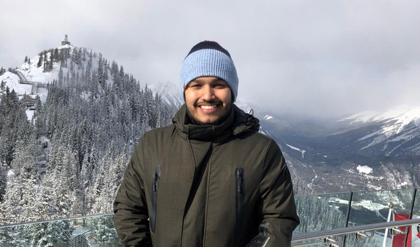 Sebastian Beltran Medina on top of Sulphur Mountain in Banff, Alberta