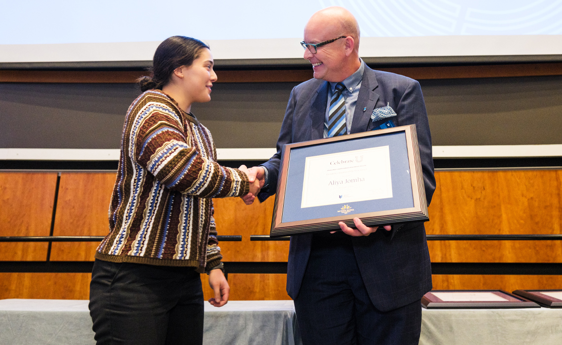 Aliya Jomha, BA Honours Psychology, receives her President’s Student of the Year Award from Mount Royal President and Vice-Chancellor Dr. Tim Rahilly, PhD.