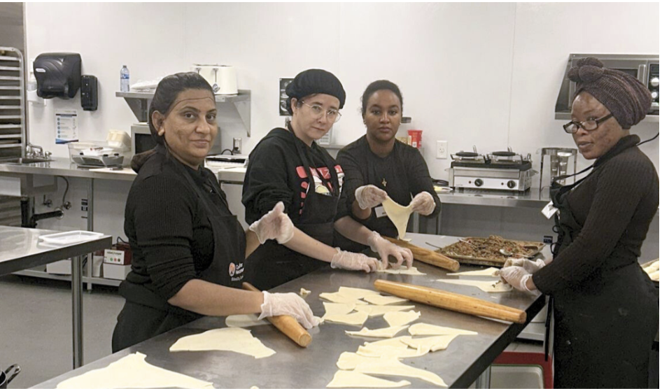 Seven MRU airplanes on the ground outside the Springbank hangar.