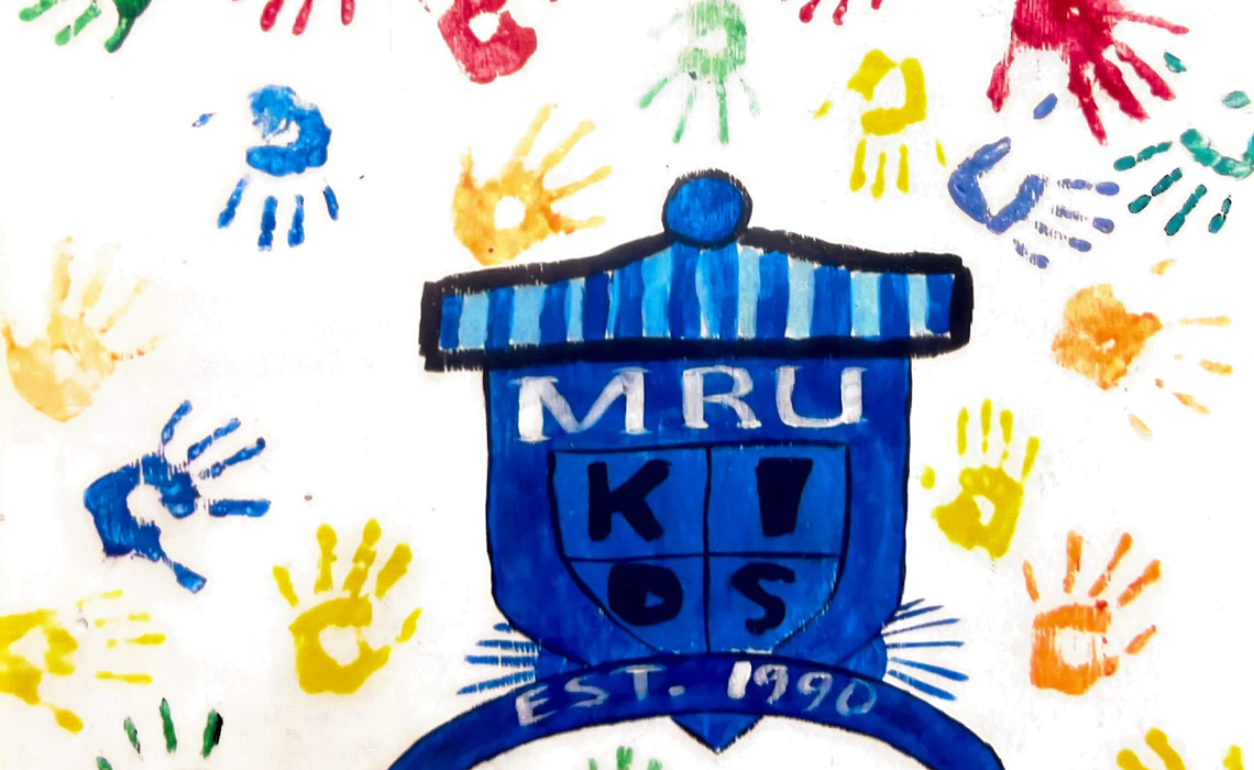 A colorful painting embellished with many handprints, highlighting community spirit and artistic expression.