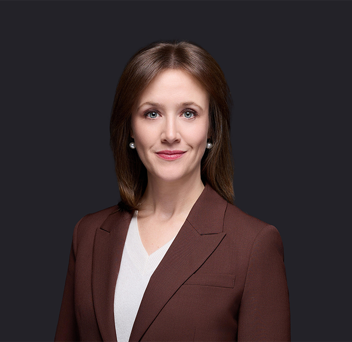 Alison Whiting stands confidently, showcasing a professional appearance.