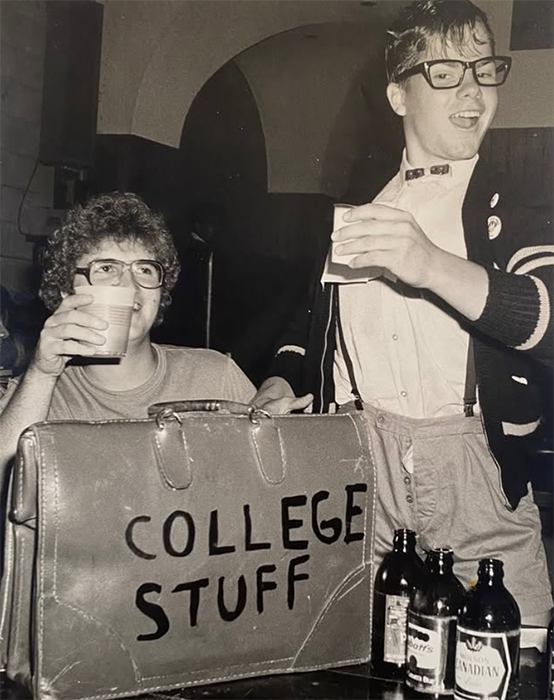 A suitcase marked "college stuff" is held by Bruce McCulloch.