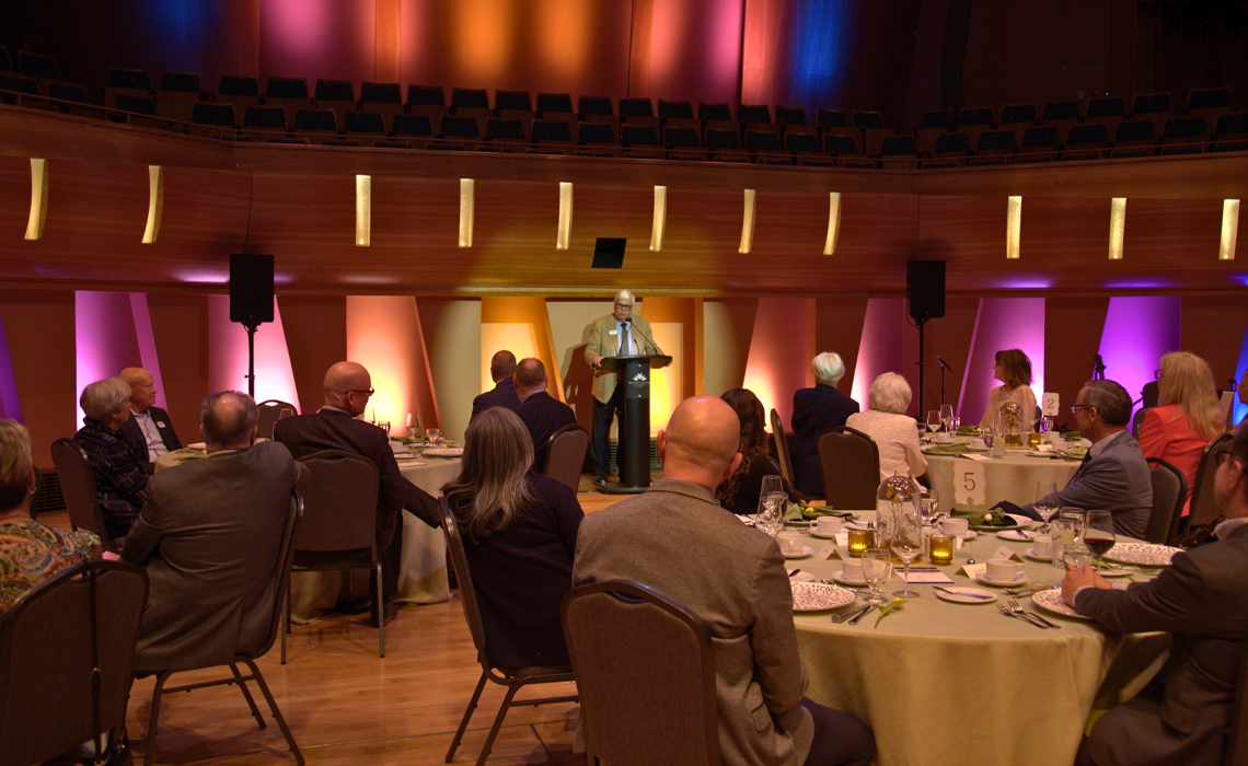 Photo 1 - George Brookman gives an address at the inaugural Community Builders Circle luncheon.