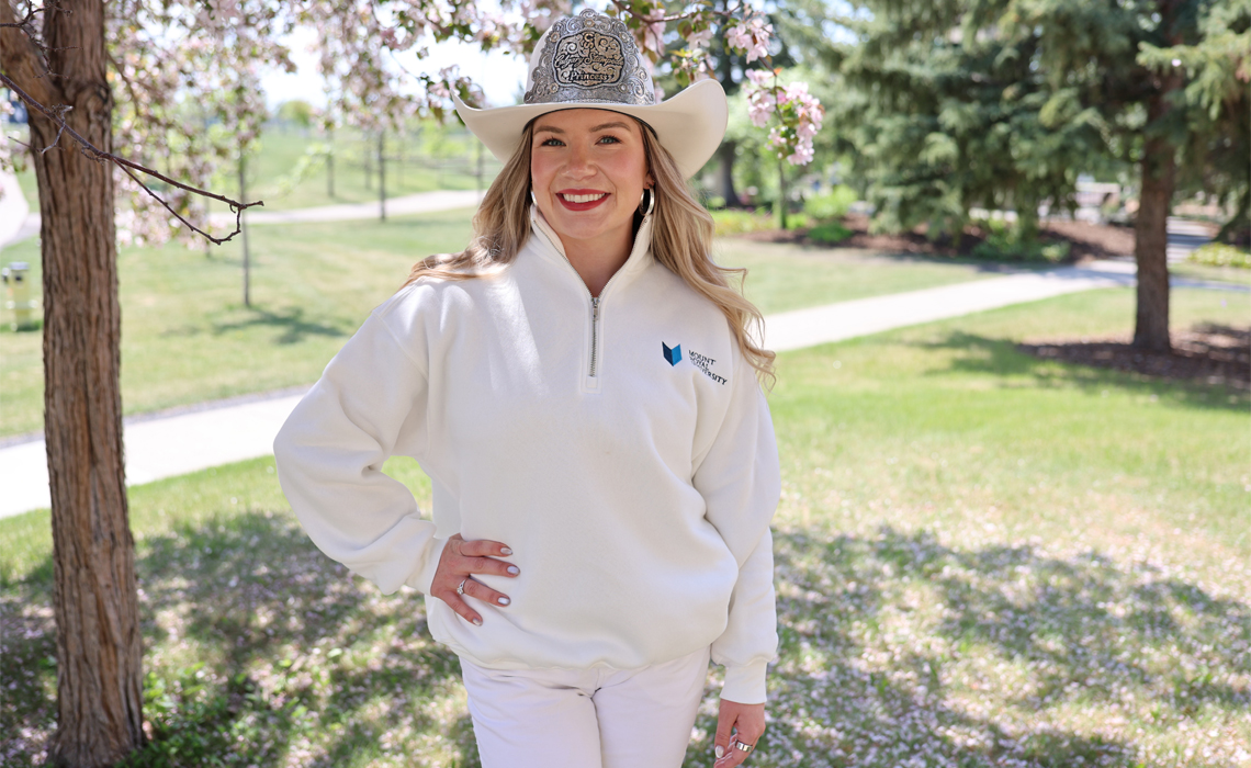 Sarah O’Brien stands confidently, showcasing a stylish and casual western-inspired outfit.