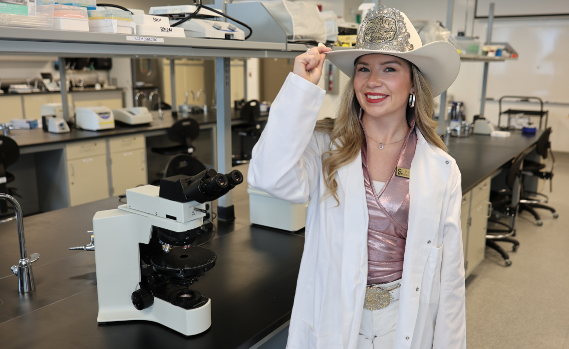Sarah O’Brien stands confidently, showcasing a stylish and casual western-inspired outfit.