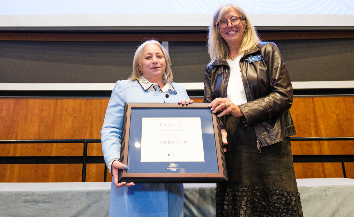Dr. Jennifer Pettit, PhD, left, Dean, Faculty of the Arts, receives the Chancellor’s Distinguished Service Award from Chancellor Arlene Strom at the inaugural Celebrate U Awards night.