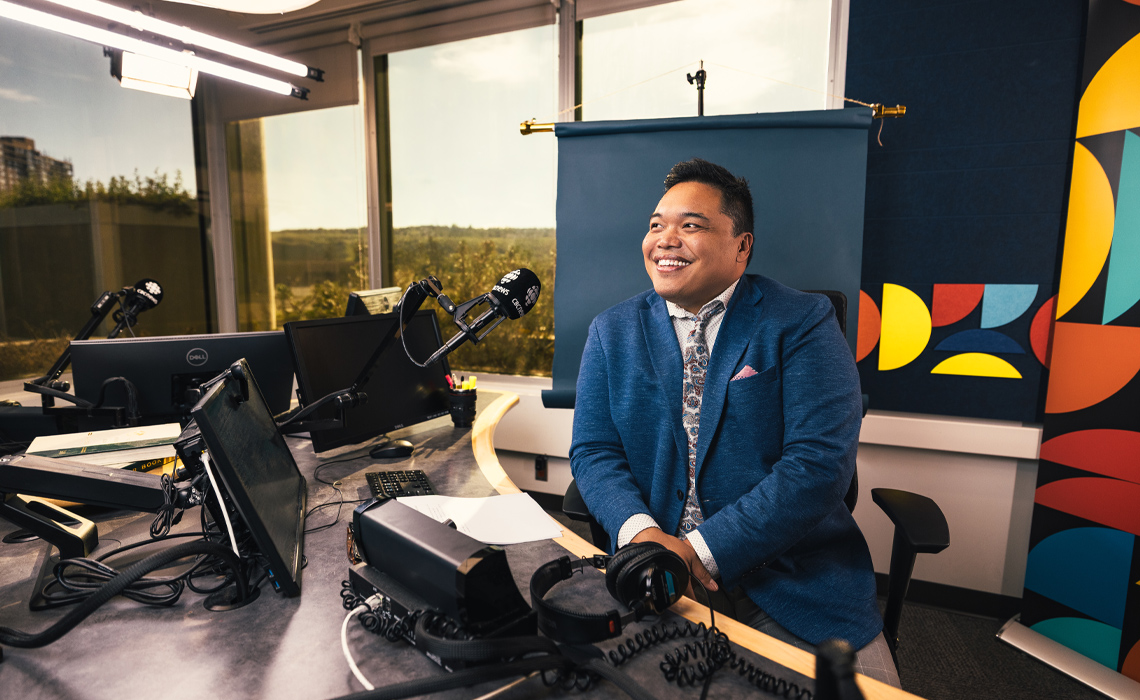 Chris dela Torre, host of Calgary's The Homestretch, poses for a photo in the studio.