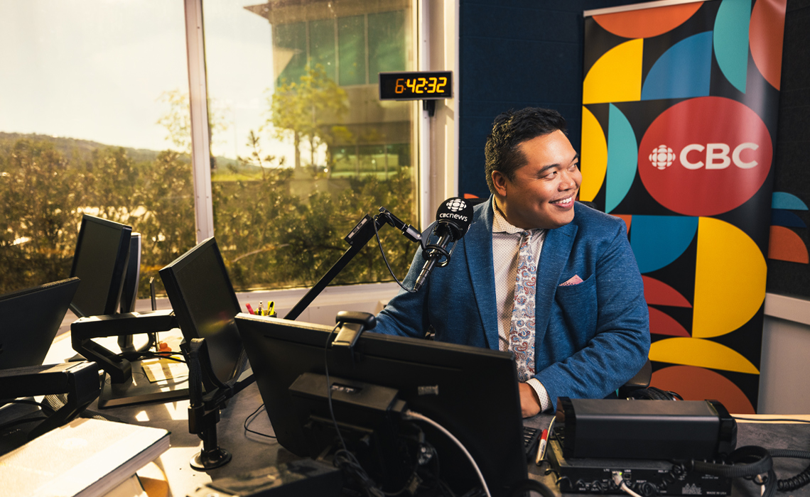 Chris dela Torre, host of Calgary's The Homestretch, poses for a photo in the studio.