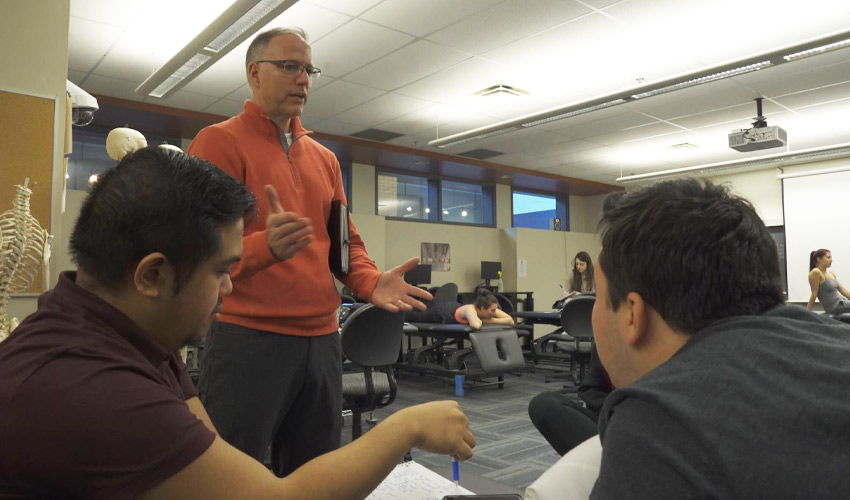 Dr. Mark Lafave, PhD, teaching a class.