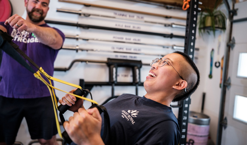 Every Body STRONGER founder Geoff Starling, left, and Rodriguez go through their paces in the "Iron Shed."