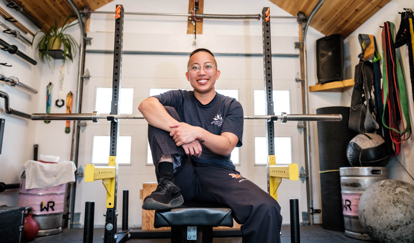 Ace portrait of Ace Rodriguez sitting on a exercise bench.