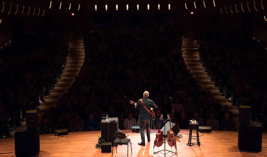 A musician performs at the Bella Concert Hall.