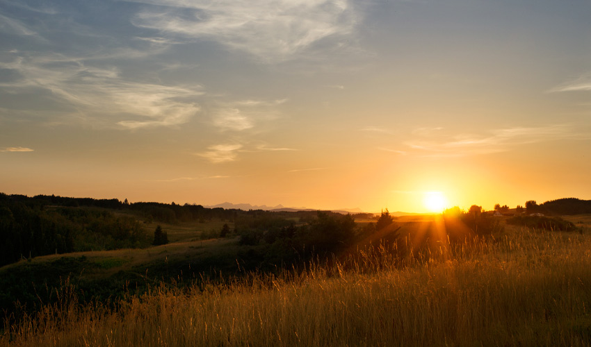 a photo of the sun setting at big hill springs.