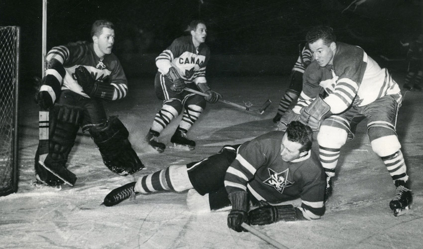 Hockey photograph from 1955 of an amateur championship game between Canada and the Czech Republic.