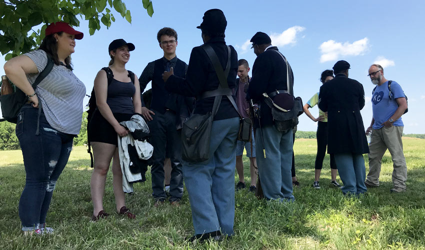 Photo of students and Prof. Joe Anderson with guides at Chancellorsville Battlefield.