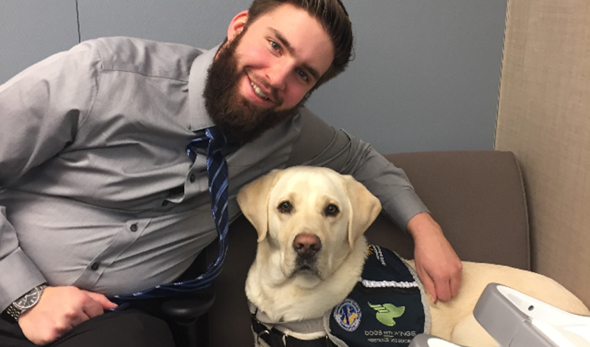 Benjamin Reid with his support dog Webster.