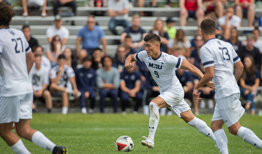 Dane Domic in action against Thompson Rivers University WolfPack.