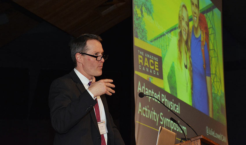 David Legg addresses the crowd at the Adapted Physical Activity Symposium.