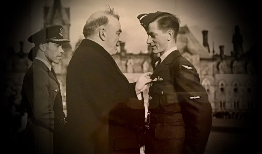 Prime Minister Mackenzie King pins wings on Ken Lett in 1942.