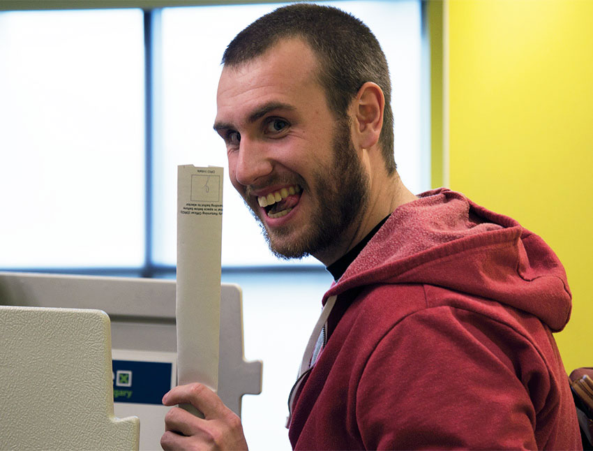 Travis Luehr votes at advance poll at Wyckham House