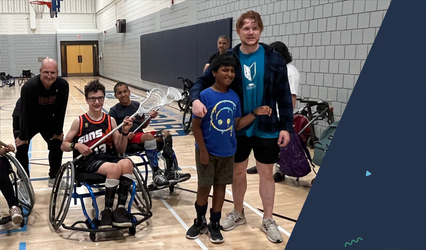 Parasports camp participants and counselors posing for a photo in the MRU gymnasium.