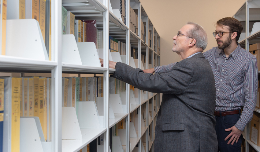 Peter Houston and Robert Blaine browse the Blaine Canadian sports history collection.