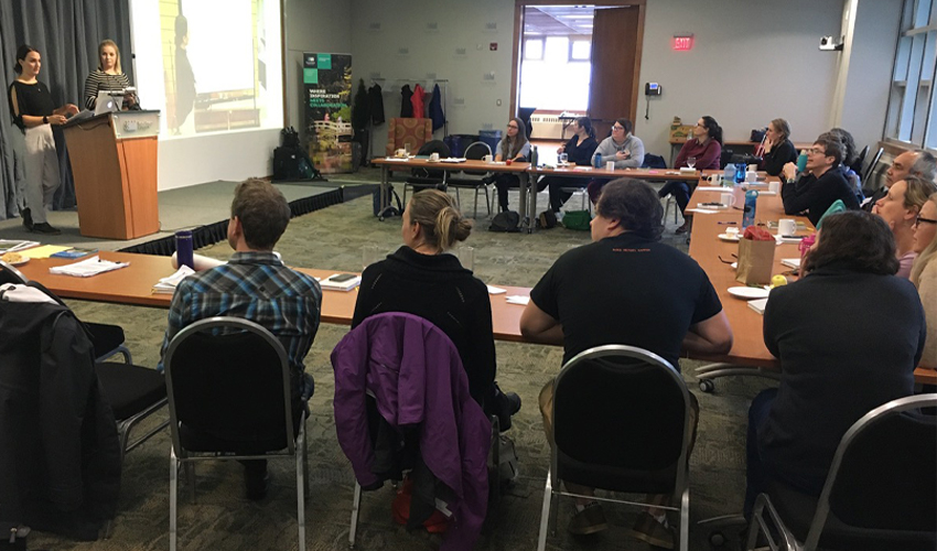 Photo of Johnson and Upshall presenting to parks professionals at the residency in Victoria.