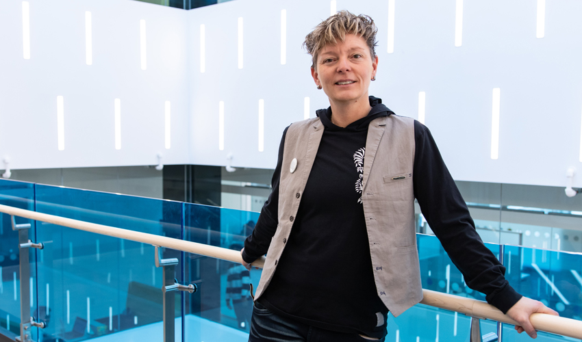 Dr. Natalie Meisner, PhD, poses for a photo in the Riddell Library and Learning Centre.