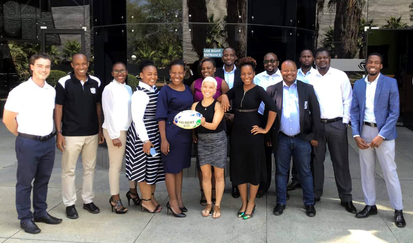 Photo of Savannah Cruz with the Botswana Olympic Committee and Botswana Rugby Union staff.