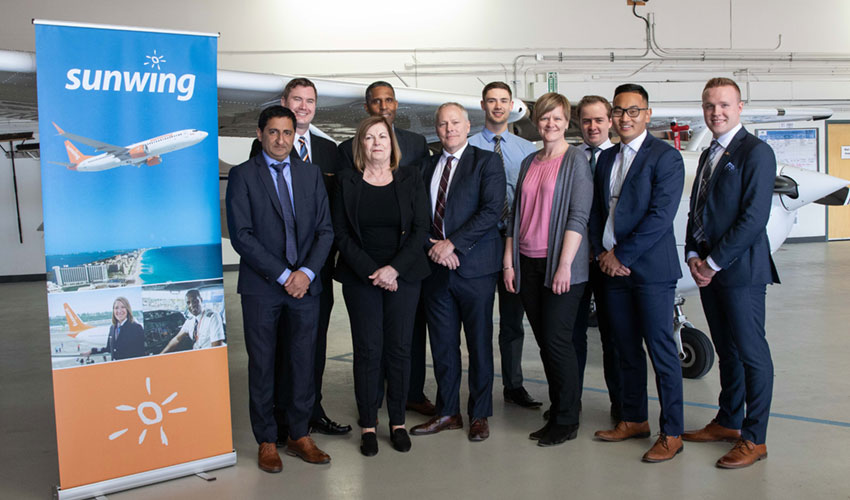 Aviation students, faculty and staff posing at MRU Springbank campus.
