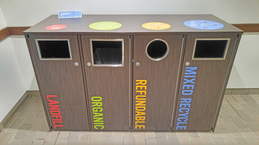Photo of Mount Royal University recycling bins using colourful, compelling iconography that clearly showed what should go where.