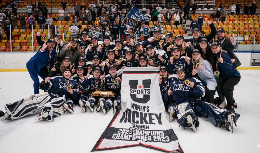 The Mount Royal University Cougars women's hockey team celebrating their U SPORTS Women's Hockey National Championship.