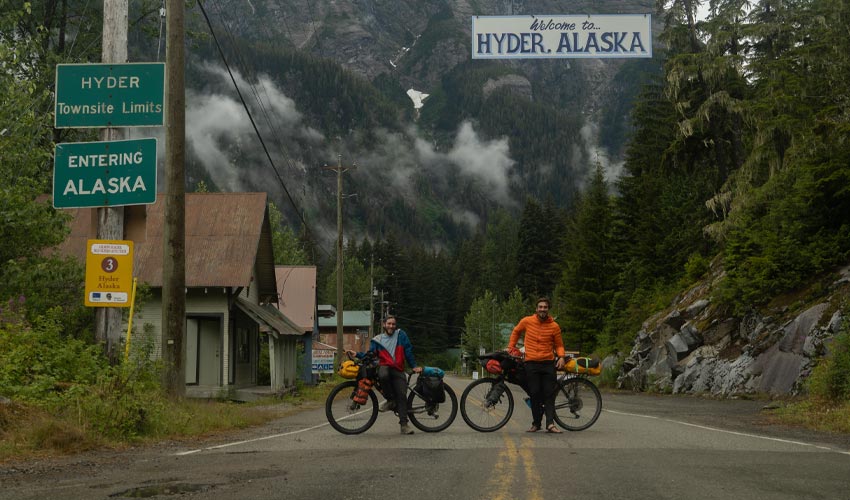 Ecotourism and outdoor leadership student Teegan Neame (right) and bikepacking companion John Morleand, who he met in Grand Teton National Park, celebrate their arrival to Alaska.  
