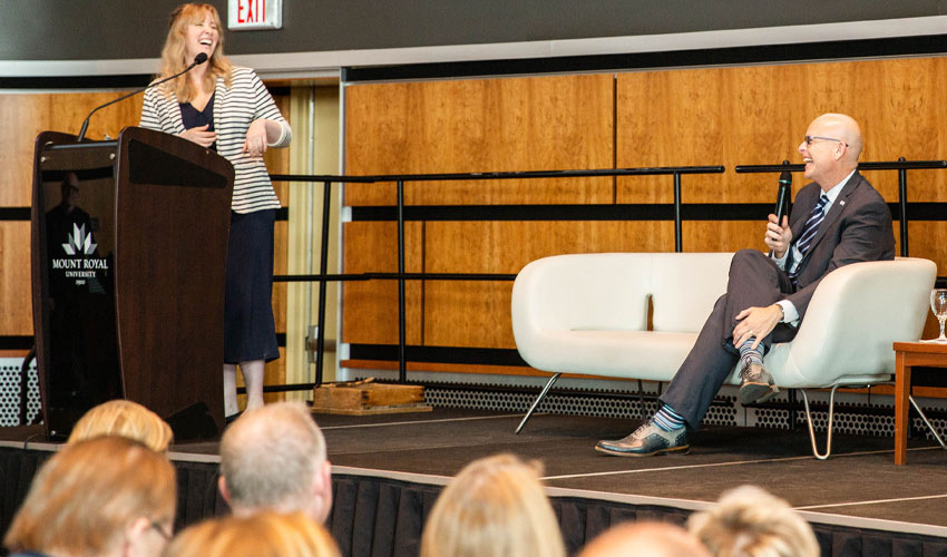 Dr. Rahilly on stage with Meg Wilcox, assistant professor (Journalism) at an event that officially introduced him to employees in 2019.