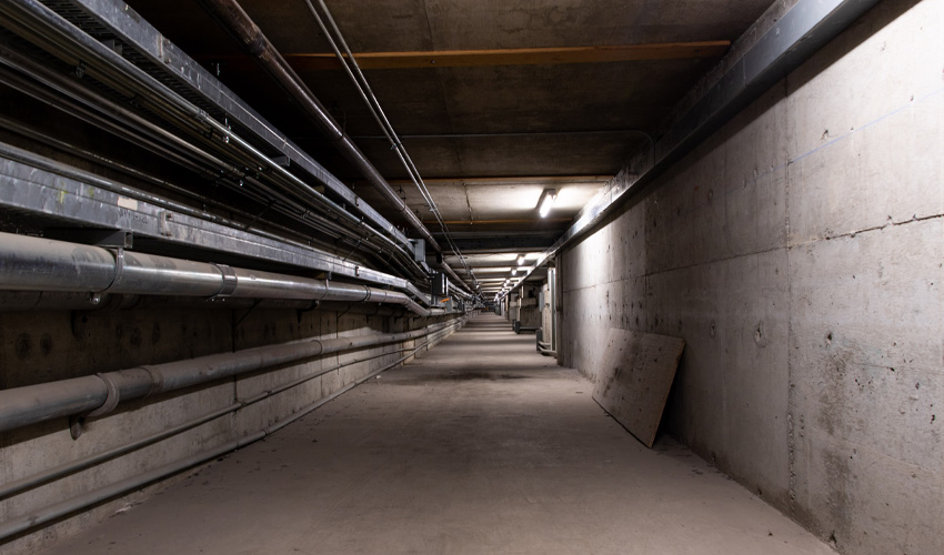 The middle and longest section runs under Main Street and the old library space.