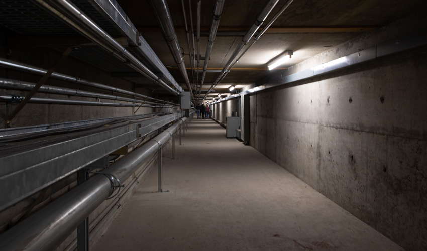 The final section extending under E-Wing. At left is a cable tray, with a second one running above.