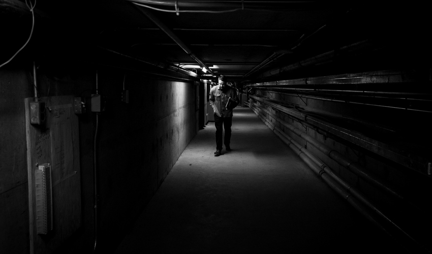 Dylan Pritchard stoops as he walks under the last part of the tunnel, where the ceiling is shortest.