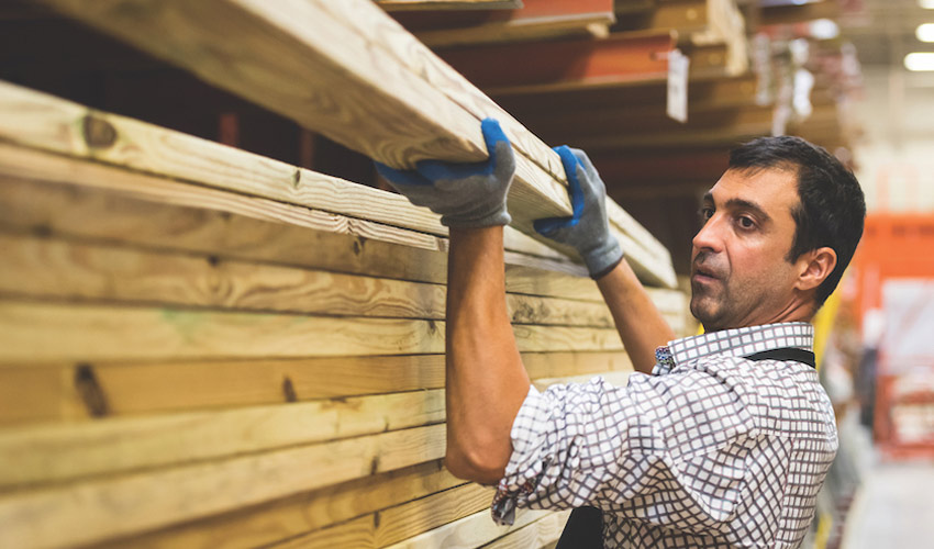 Photo of man handling building material