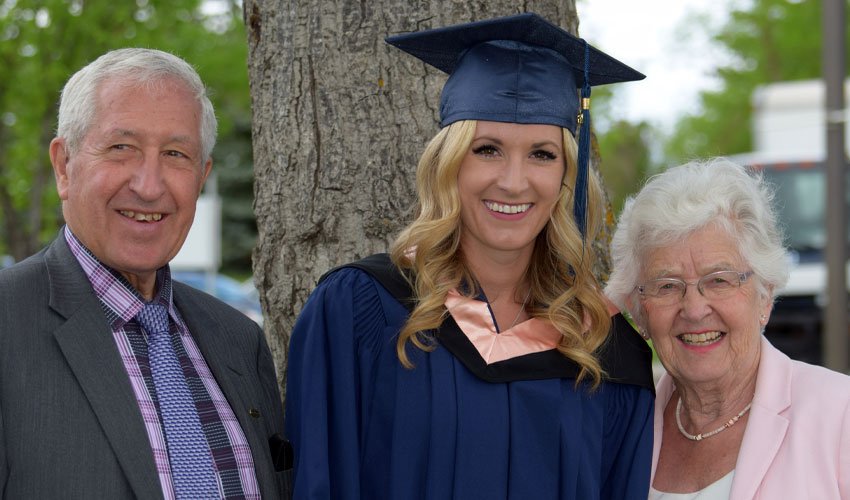 Photo of Bob Brawn, Jenn Whyte and Carole Brawn proudly celebrate Whyte's graduation from Mount Royal's nursing program in 2018.