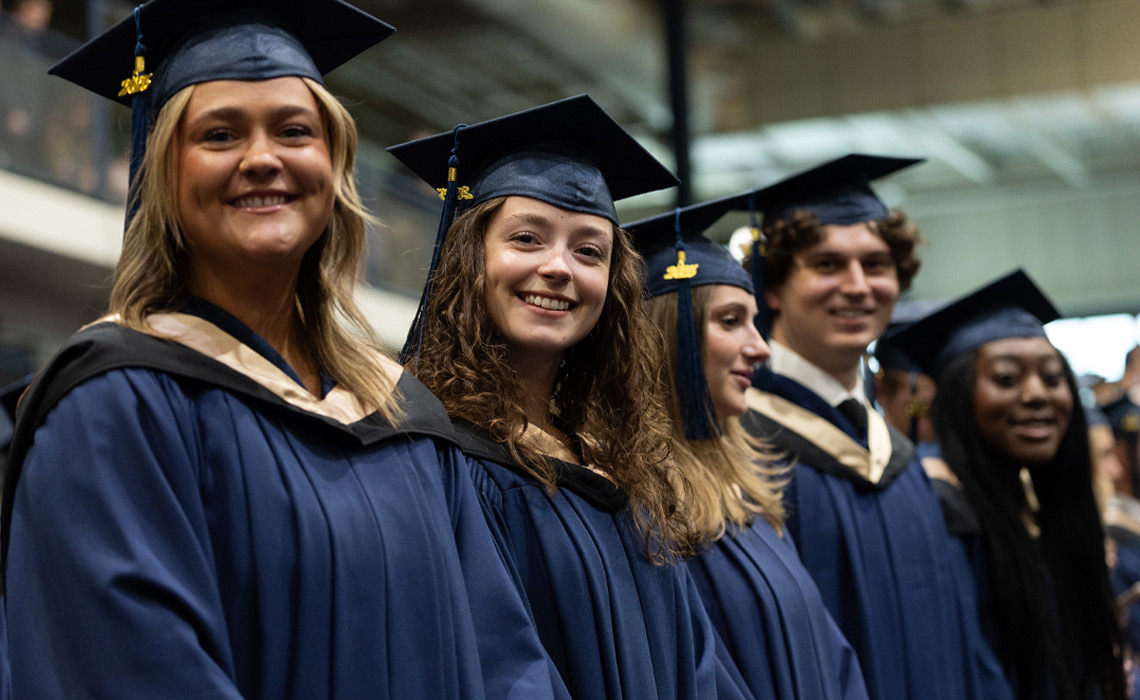 MRU graduates wearing gowns and caps celebrate their achievement at Convocation 2025.